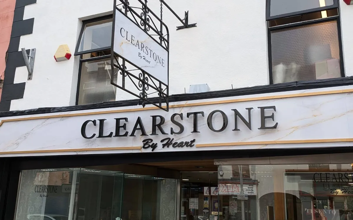 Clearstone by Heart jewellery shop front with a wrought-iron hanging sign and marble-effect fascia lettering.