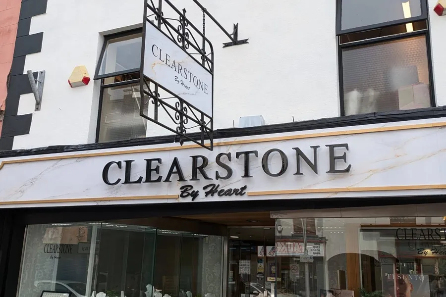 Clearstone by Heart jewellery shop front with a wrought-iron hanging sign and marble-effect fascia lettering.