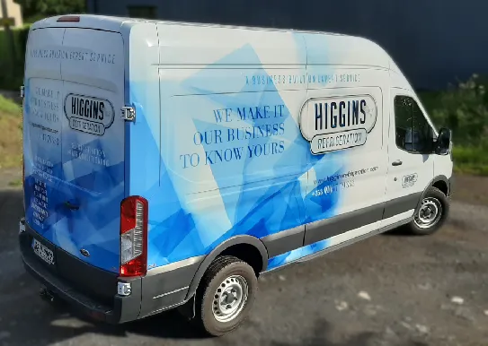 Higgins Refrigeration delivery van finished in a full blue and white vinyl wrap.