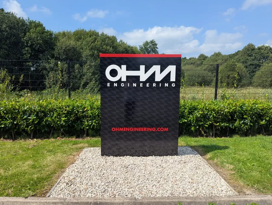 OHM Engineering freestanding illuminated totem sign at the entrance to their site.