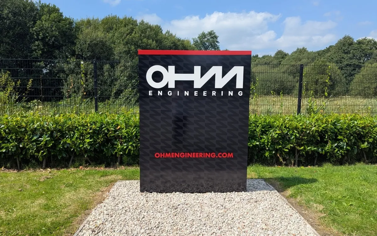 OHM Engineering freestanding illuminated totem sign at the entrance to their site.