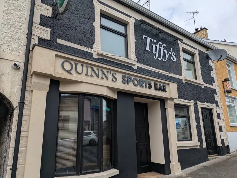 Quinn's Sports Bar building with raised dimensional fascia lettering above the entrance.