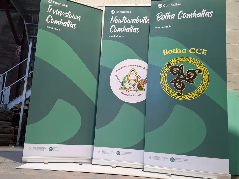 Three roll-up banners for Comhaltas branches (Irvinestown, Newtownbutler and Botha) finished in green branded artwork.
